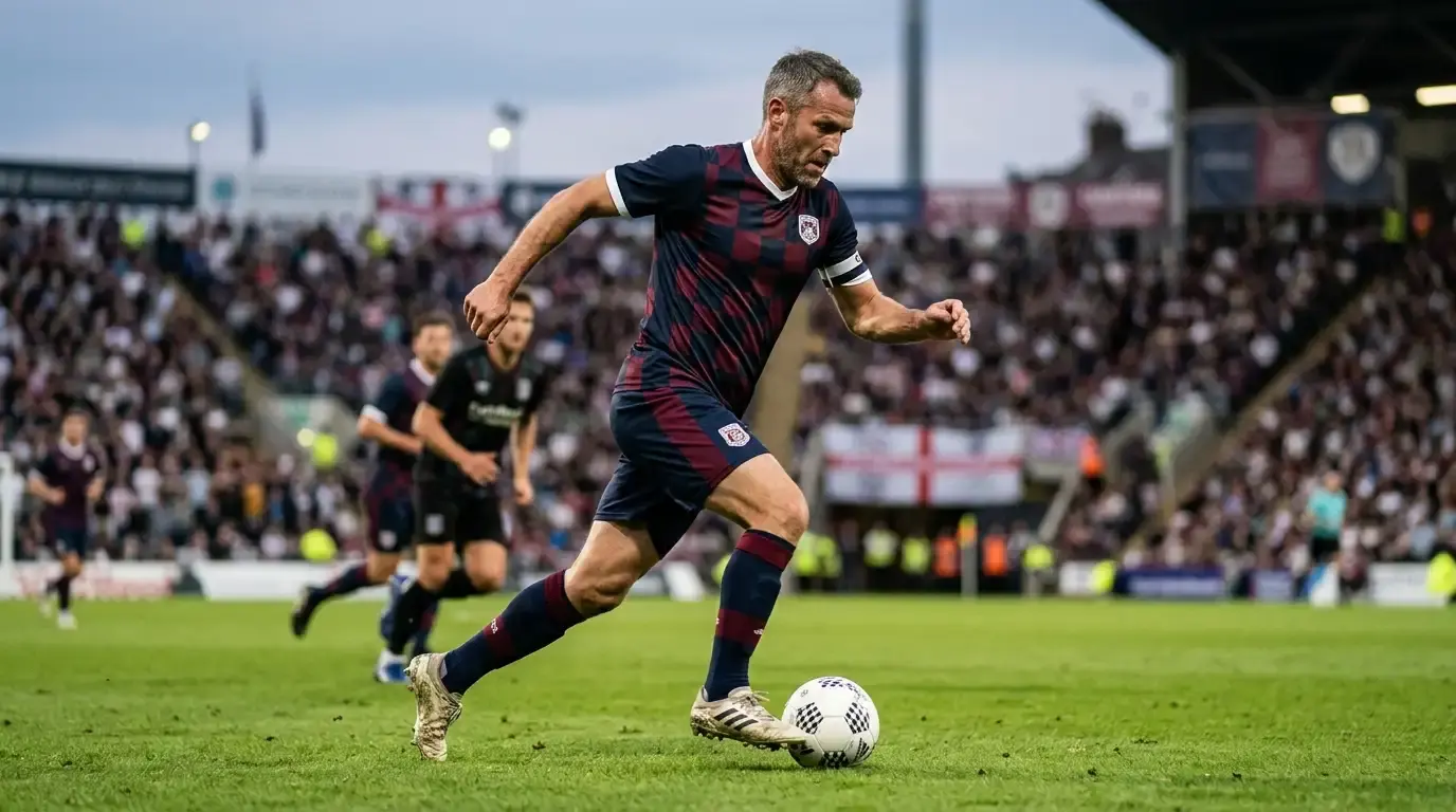 Doświadczony rozgrywający prowadzi piłkę w środku pola podczas Mundialu 2026